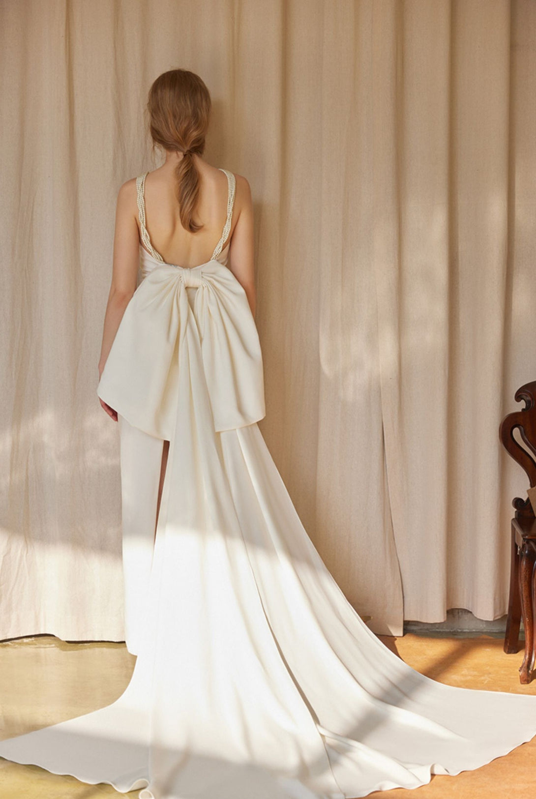 pearl strap satin dress Pearl Strap Halter Satin Wedding Dress with Dramatic Back Bow and Train