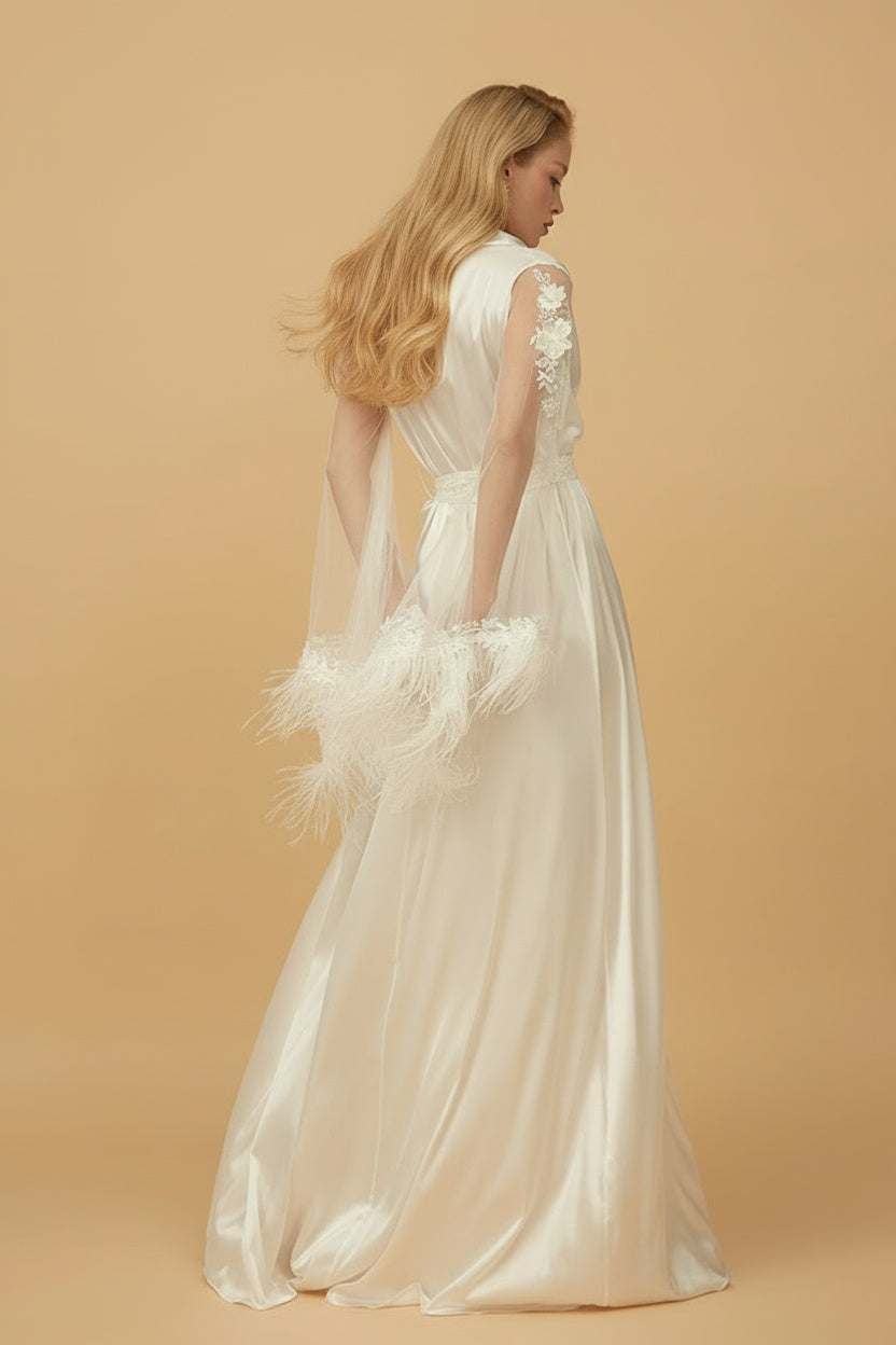 Woman in a white wedding dress with lace details on a beige background