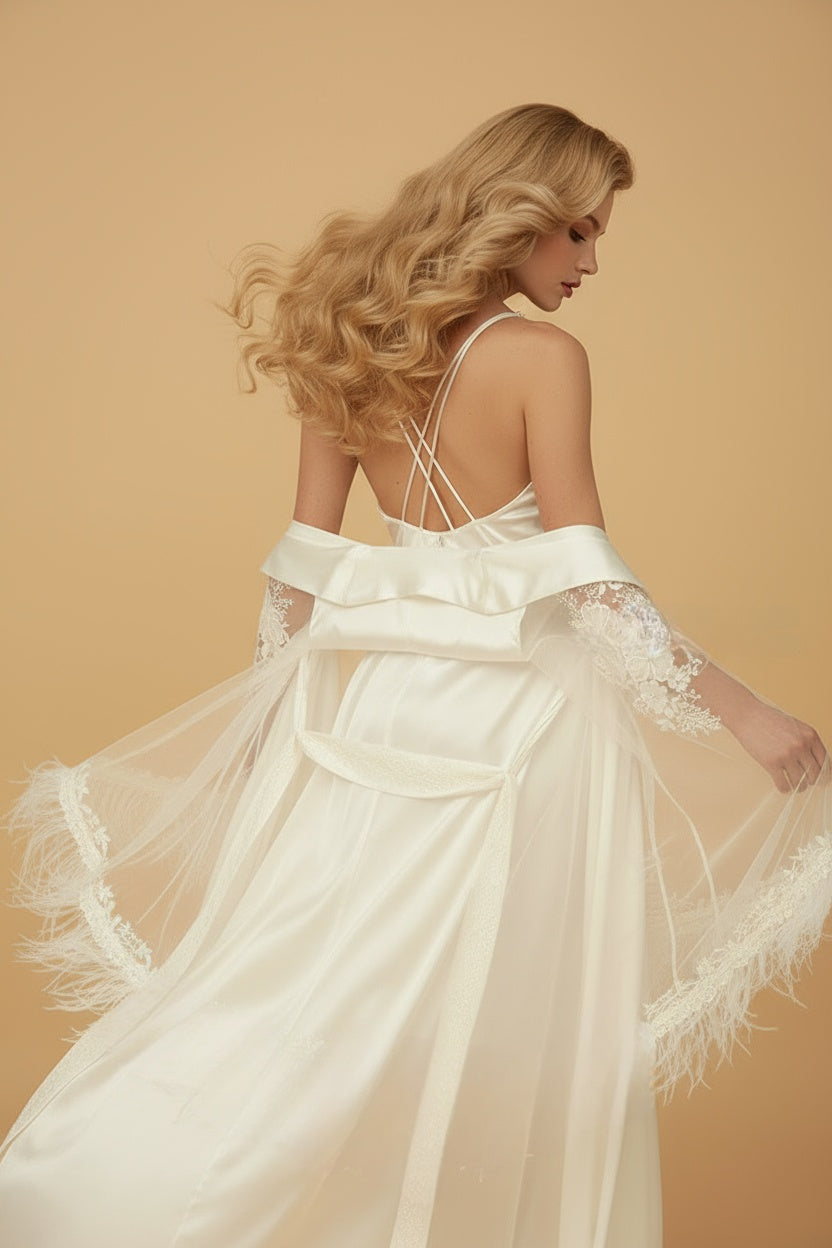 Woman in a white wedding dress with lace details on a beige background